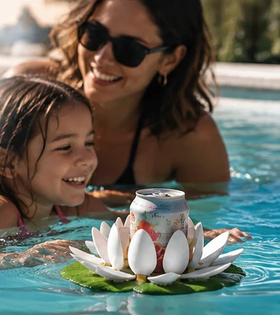 Smiling mother and daughter in a pool with a floating drink holder carrying a can